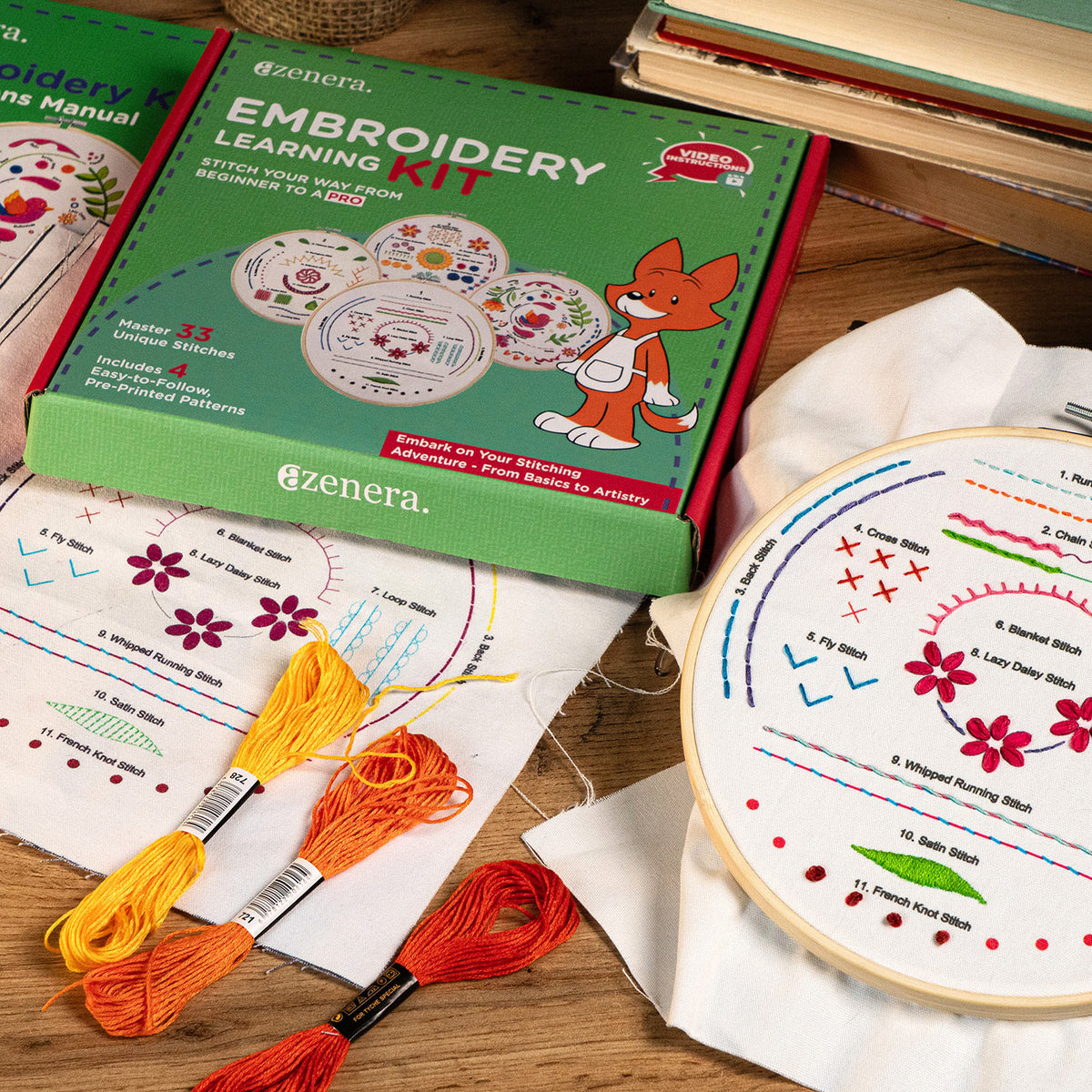 Azenera  Embroidery Learning Kit shown with its green retail box, embroidery hoops, thread, and printed stitch guides on a wooden surface.